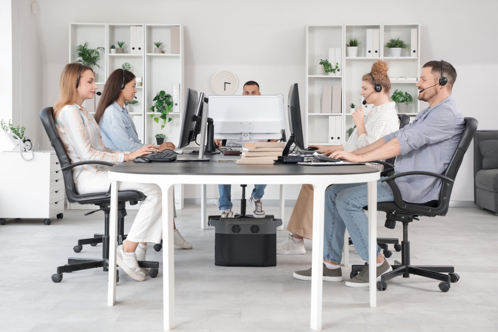 Technical,Support,Agents,Working,At,Table,In,Office